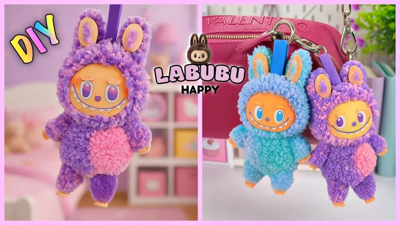 عروسک لبوبو دست ساز با کاموا به رنگ‌های صورتی و آبی، ساخته شده به روش پوم پوم، بسیار نرم، فانتزی و مناسب آویز کیف یا هدیه