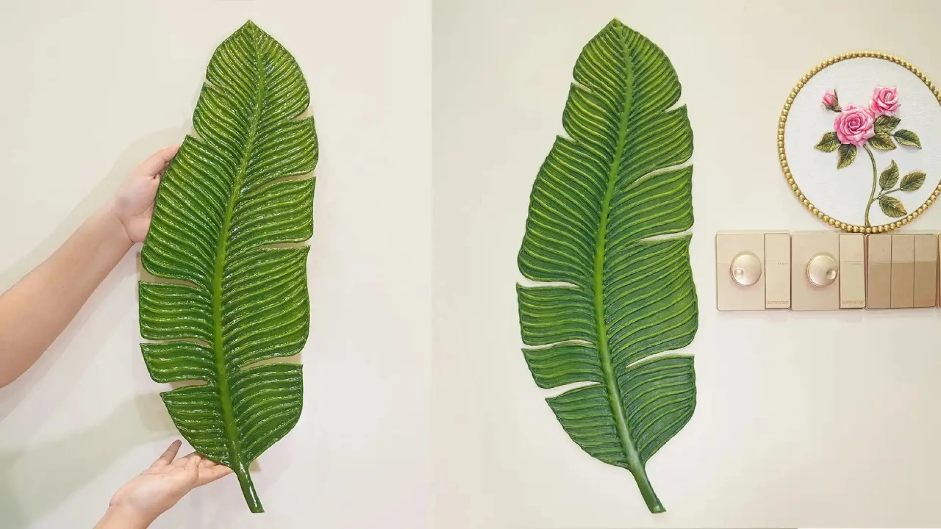 مراحل ساخت و نصب تابلوی دکوراتیو بزرگ به شکل برگ برجسته سبز رنگ که با مقوا ساخته شده و روی دیوار سفید نصب شده است.