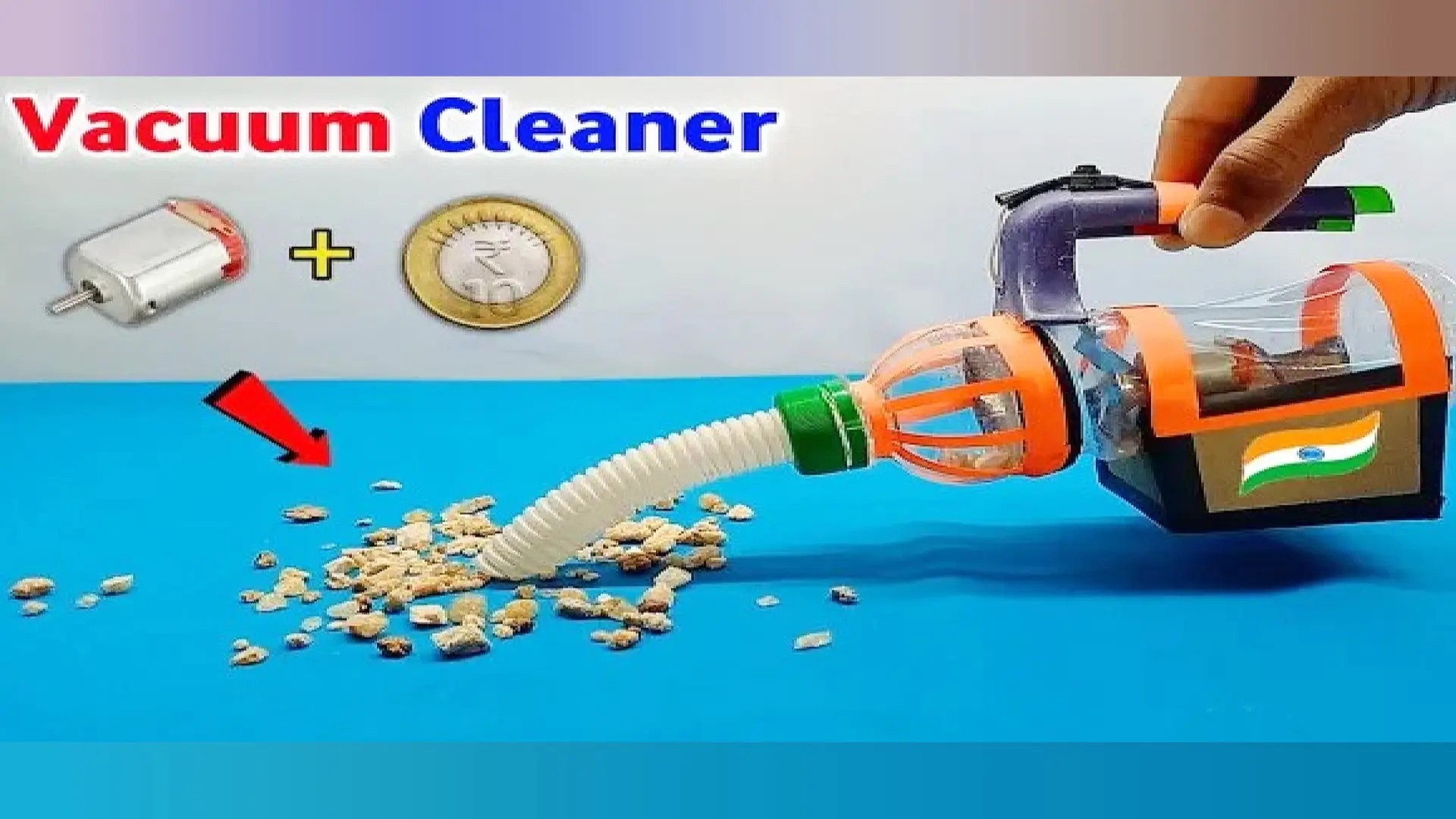 جارو شارژی دستساز با بدنه بطری پلاستیکی و شلنگ خرطومی در حال جمع کردن خردهریزها روی میز آبی