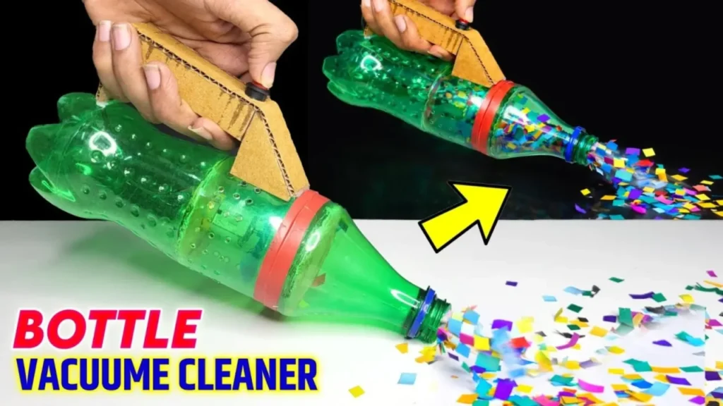 آموزش ساخت جاروبرقی دستی با استفاده از یک بطری نوشابه سبز رنگ، دسته کارتنی و موتور کوچک که در حال مکش خرده‌های کاغذ رنگی است.